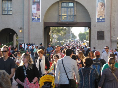 A crowd of visitors walking in Balboa Park, San Diego, California